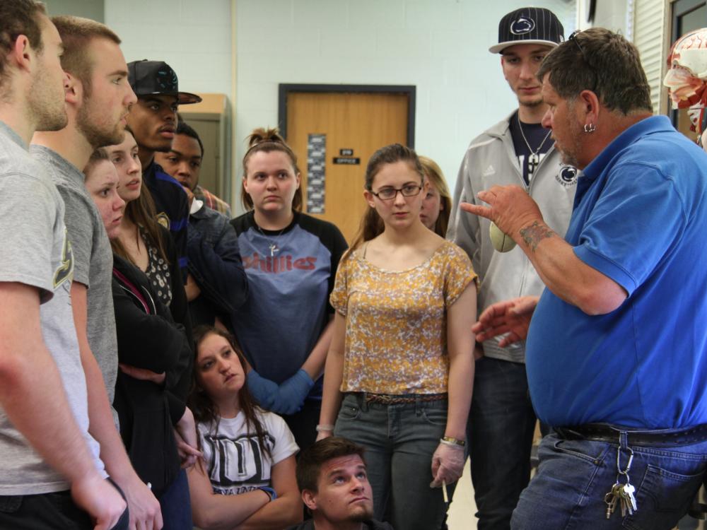 Students gather around John Long