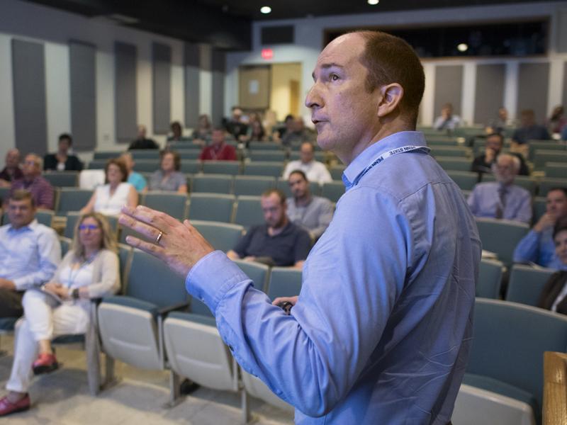 Andrew Muirhead presents his talk to faculty and staff