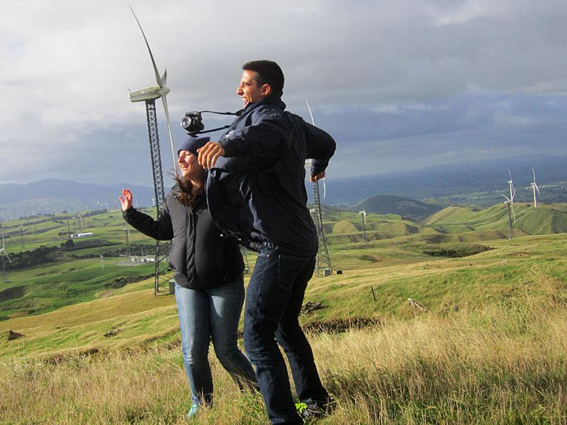 Students embracing the wind at wind farm