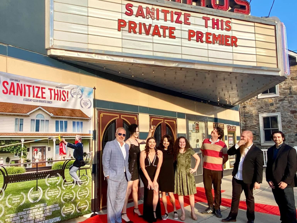 "Sanitize This" film poster banner with nine people on red carpet in front of Emmaus theatre marquee reading, "Sanitize This Private Premier"