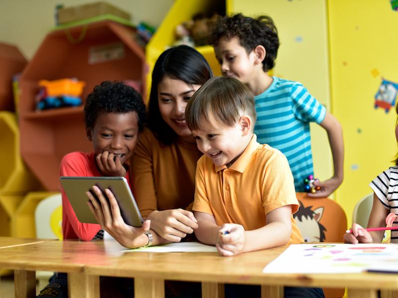 Children and teacher having fun learning