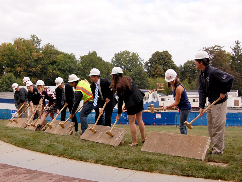 Breaking cement at the HUB expansion ceremony