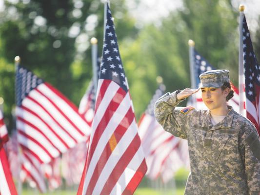 Female Army veteran and flags