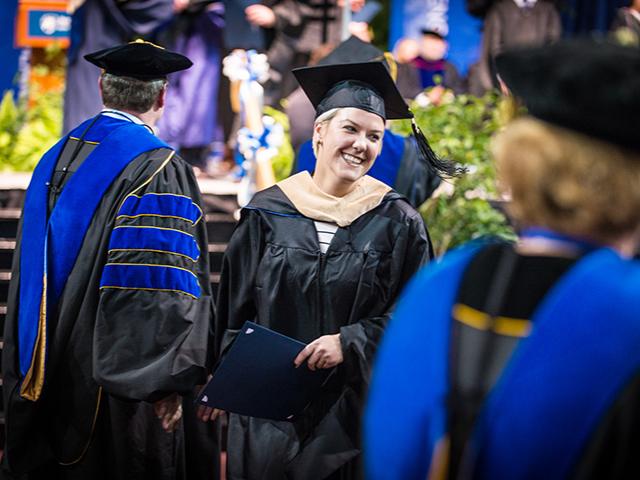 Master's degree graduate at commencement