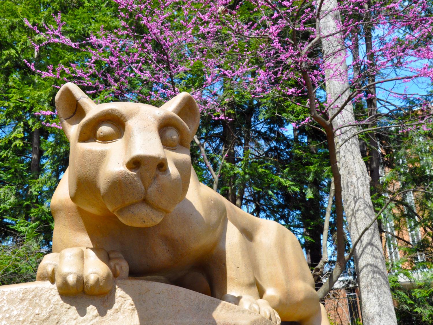 The Nittany Lion Shrine with trees in the background 