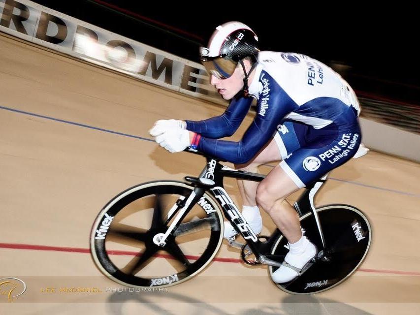 Cyclist racing on track