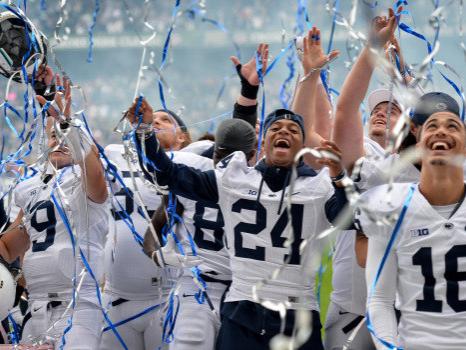 Penn State football players celebrate after defeating UCF