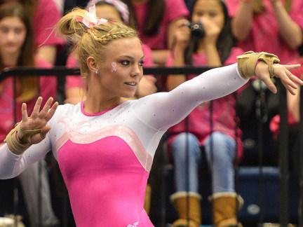 Penn State gymnast Lexi Carroll in pink leotard during floor exercise