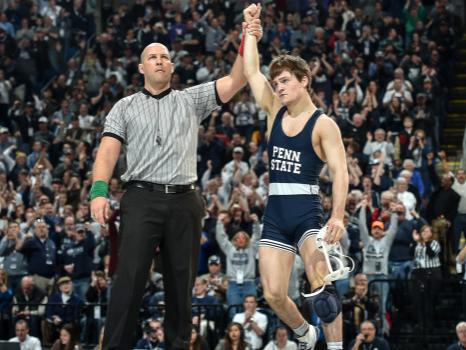  Jimmy Gulibon's with arm raised in victory after a win against Iowa