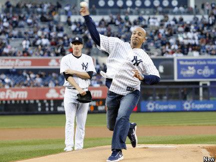 Penn State football coach James Franklin throws out a ceremonial first pitch at Yankee Stadium