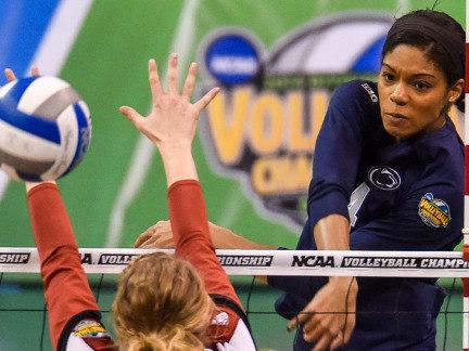 Aiyana Whitney delivers a spike at the net during the NCAA Women's Volleyball Championship