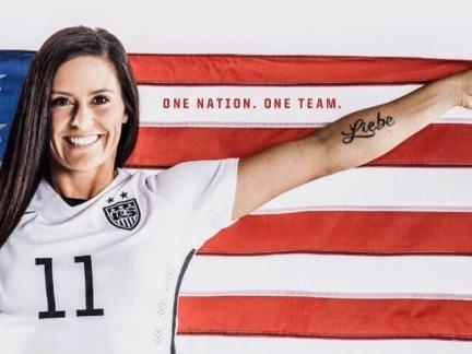 U.S. women's soccer team member Al Krieger in front of American flag