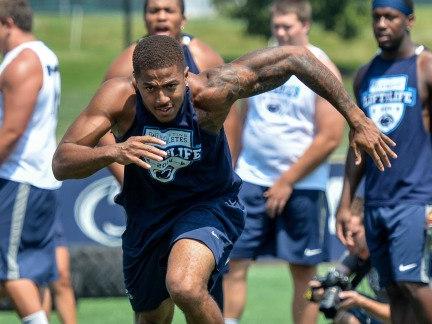 Penn State football player running