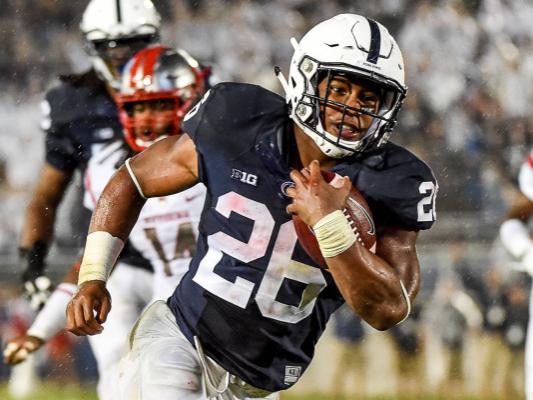 Saquon Barkley runs ball