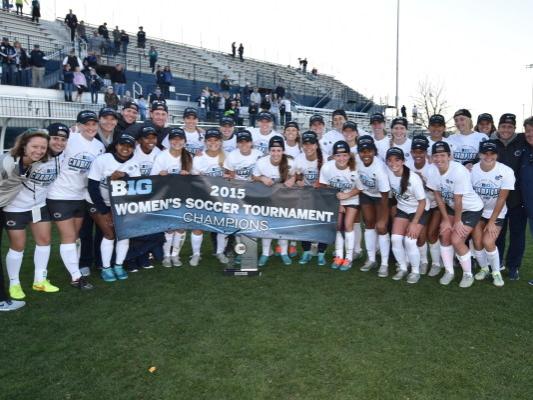 Team poses with title banner