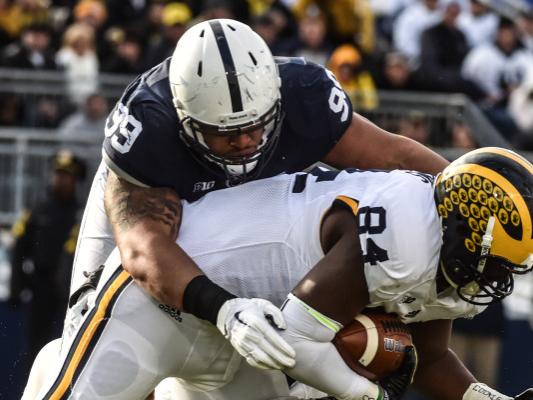 Penn State player tackles Michigan player