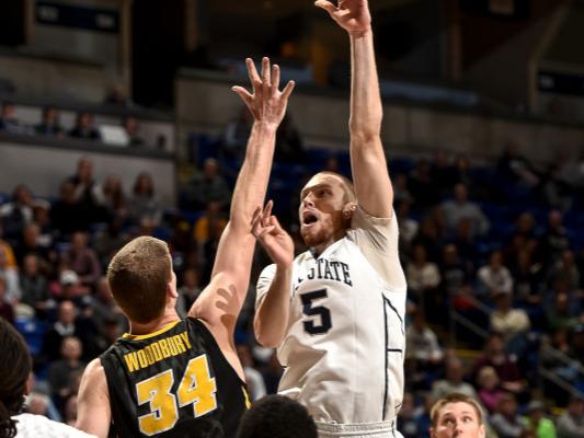 Donovan Jack shoots over Iowa defender