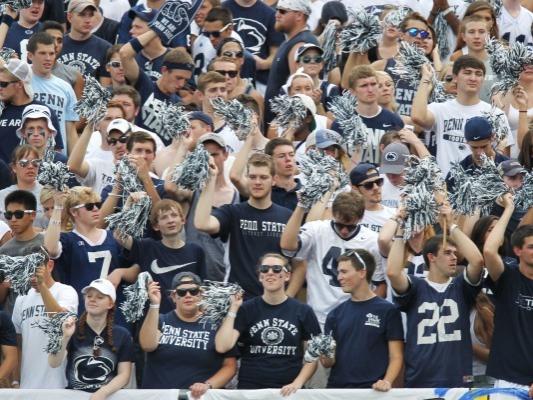 Students cheer on football team