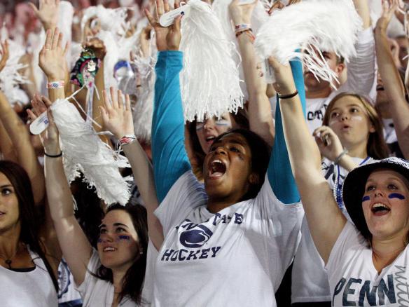 Students cheer during White Out game
