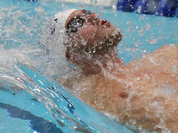 Male swimmer in backstroke