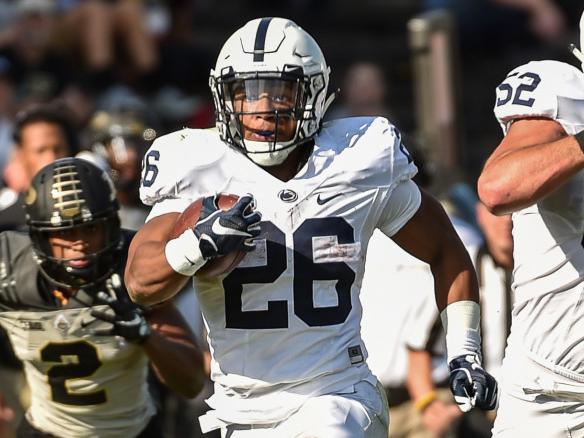 Barkley running with ball during Purdue game