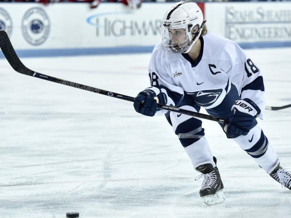 Laura Bowman advances puck