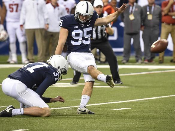 Tyler Davis kicks ball