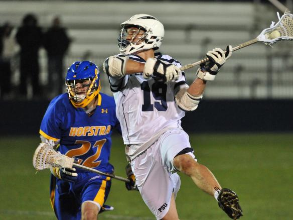 Hogan playing lacrosse