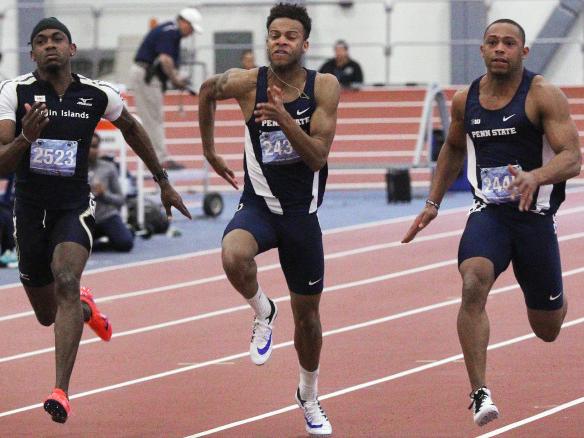 Two male track and field student-athletes running