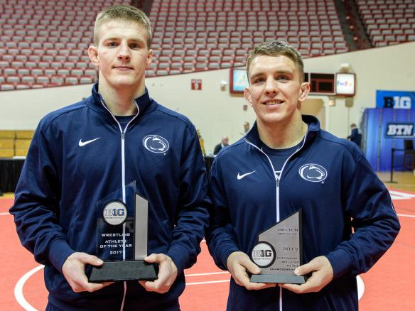 Retherford and Nolf displaying trophies