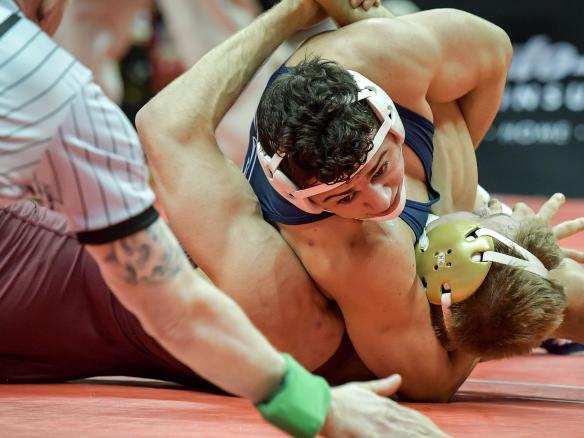 Wrestler subdues opponent