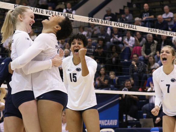 Members of the Penn State women's volleyball team celebrate