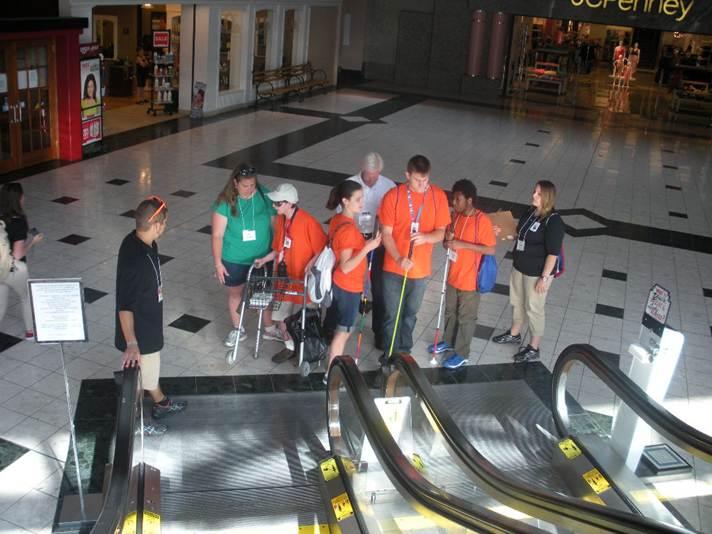 Students at bottom of escalator