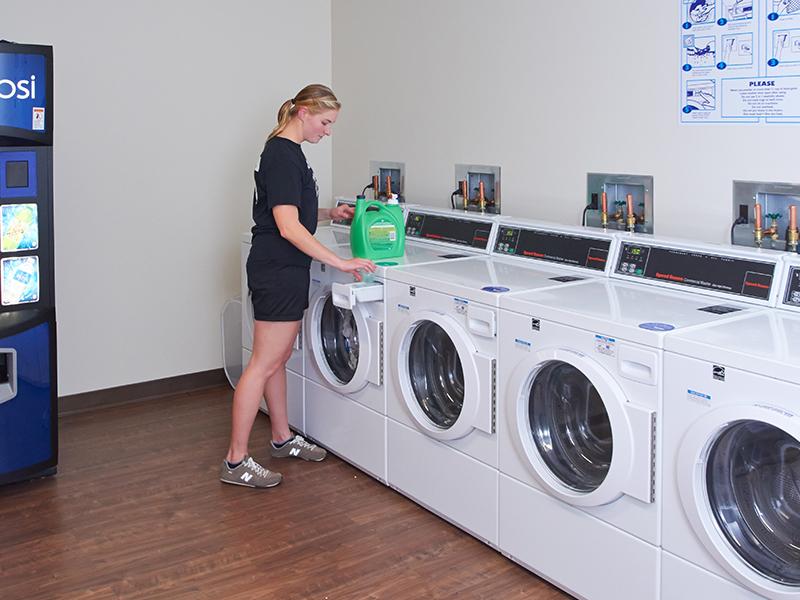 Student in on-campus laundry facility
