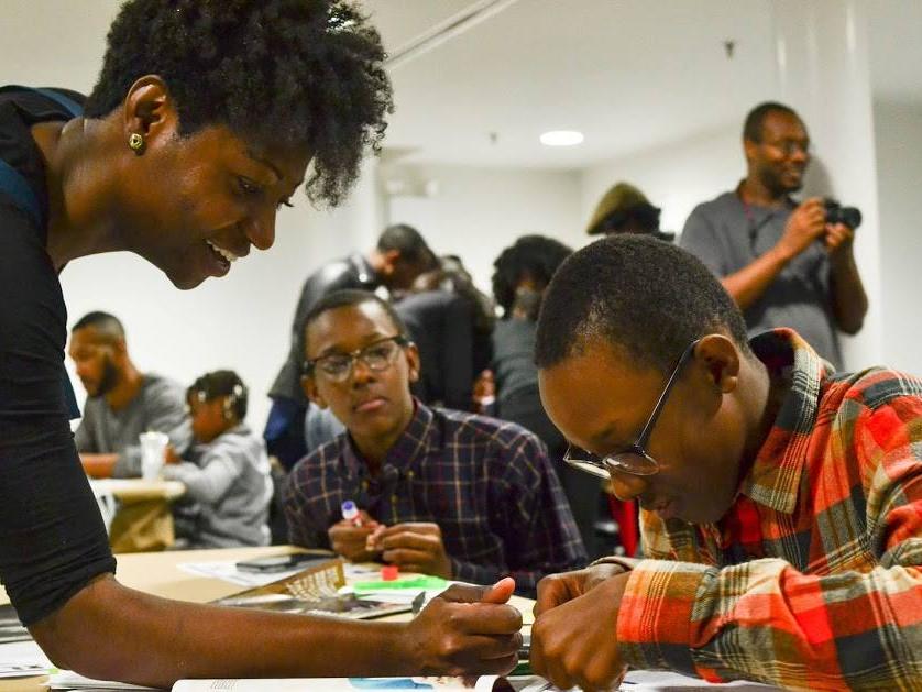 Jacqueline Jackson works with two boys during a mentoring session.