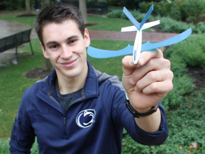 Andrew Bellows holding a 3-D printed glider