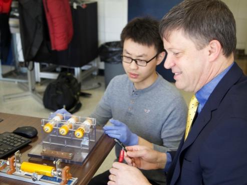 Chris Rahn working with a student in his lab