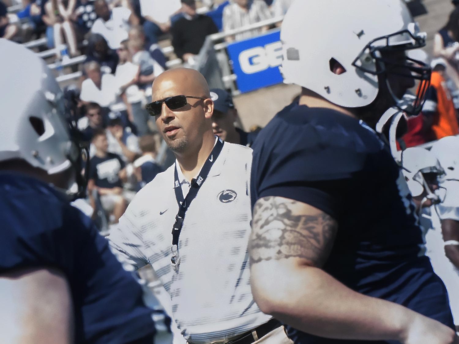 Coach Franklin coaching football players