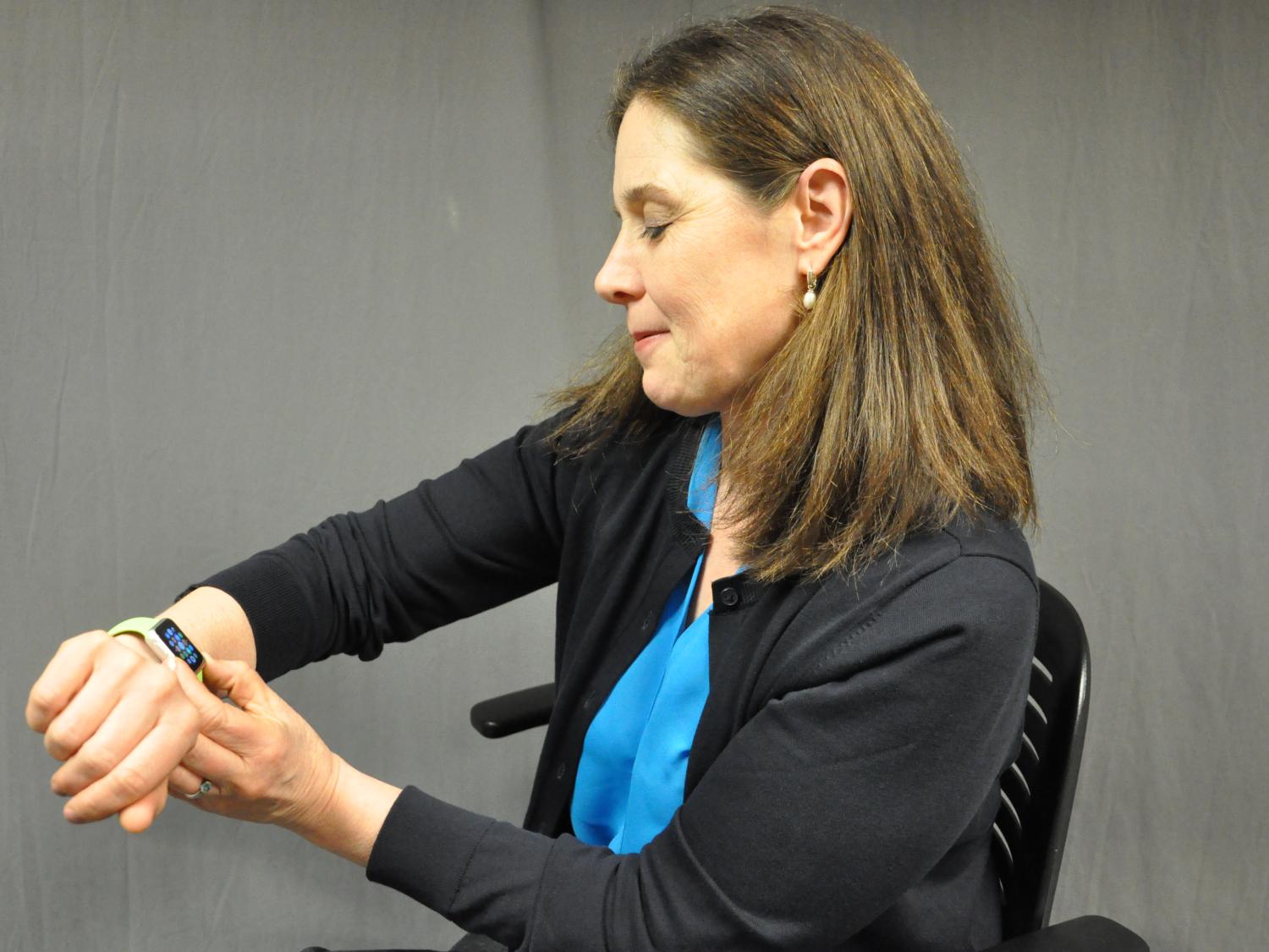 Rayne Sperling access an app on her Apple Watch while wearing it on her wrist