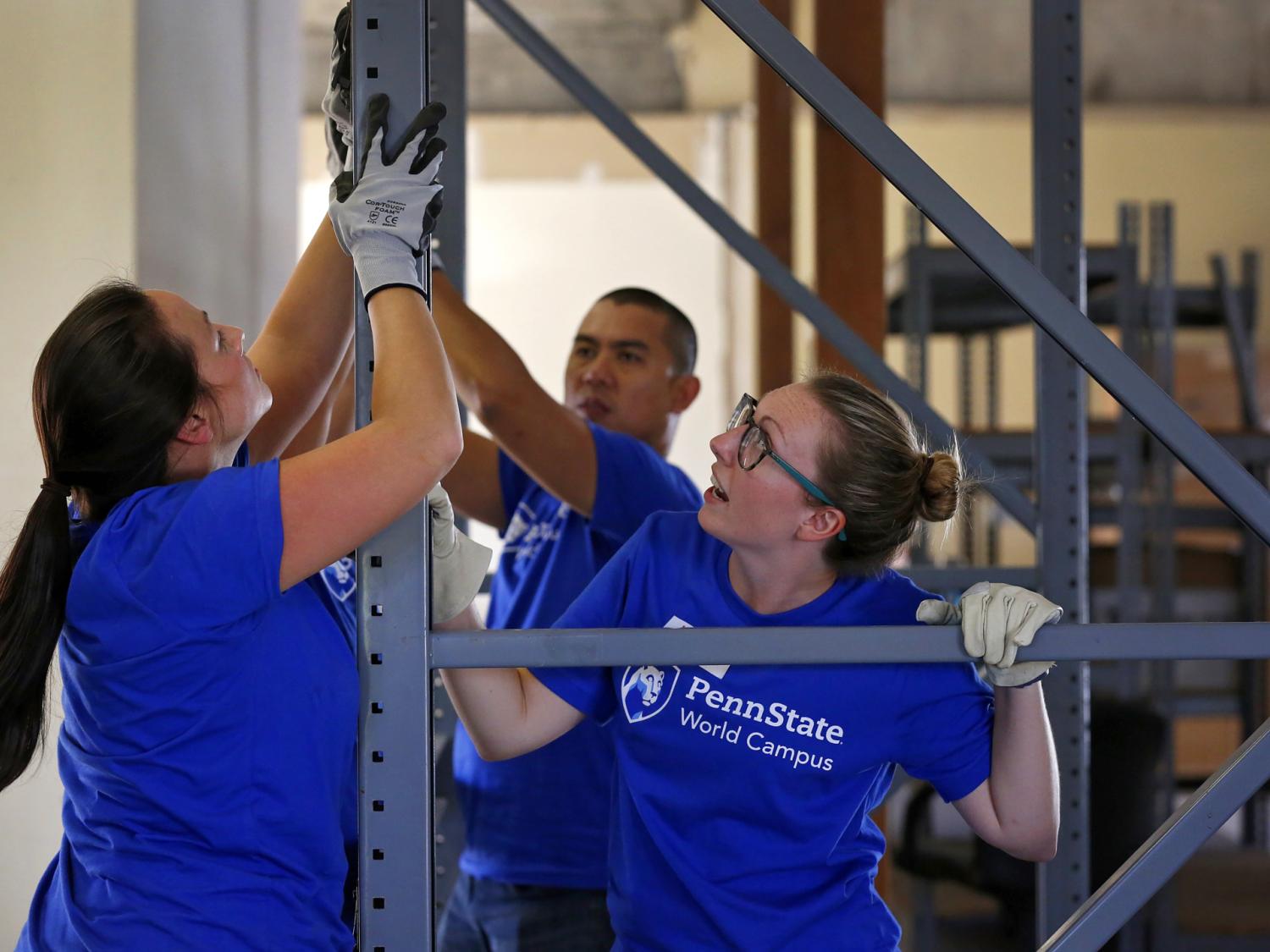 World Campus student volunteers work on building