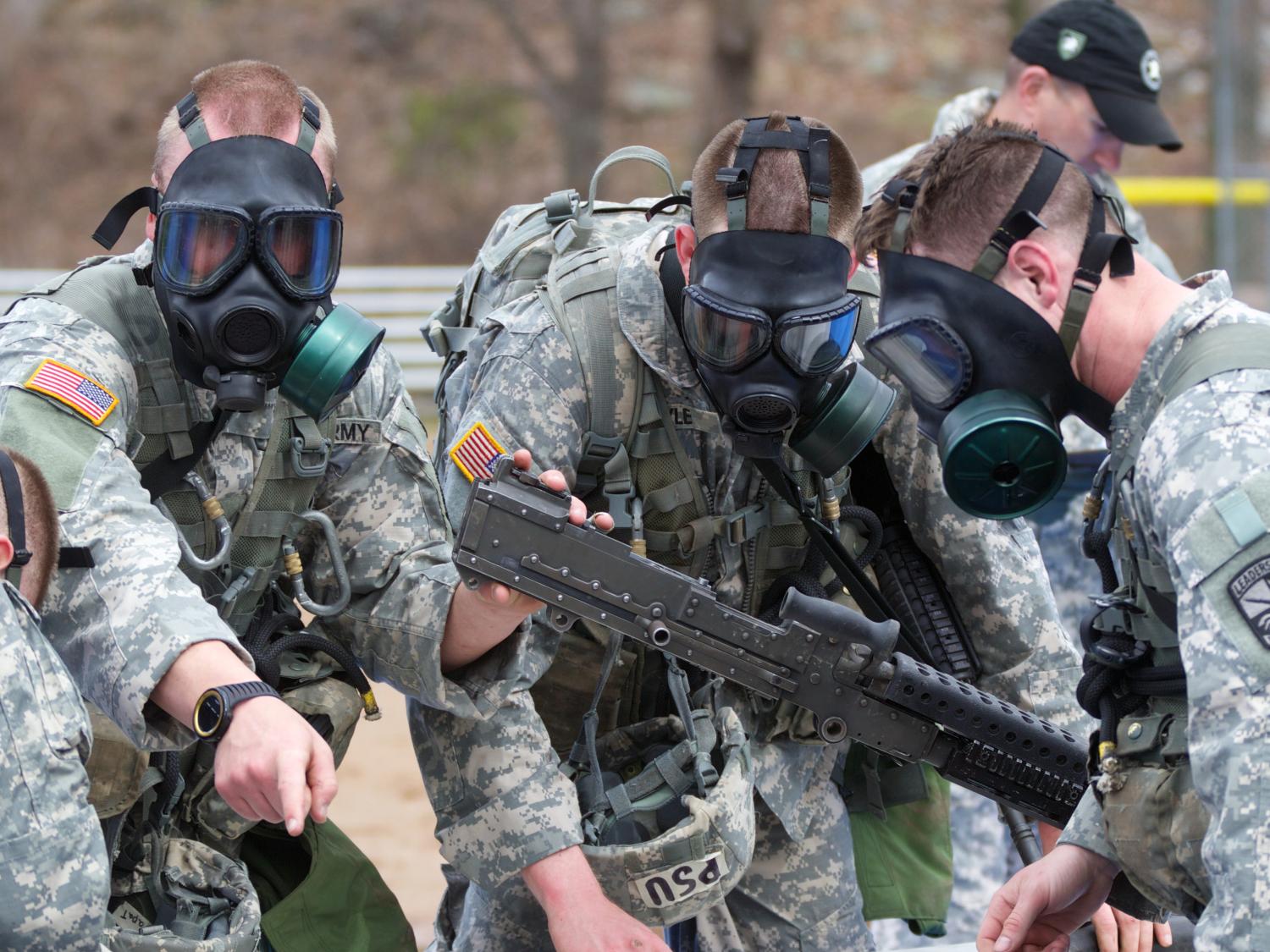 The Penn State team assembled weapons while wearing gas masks