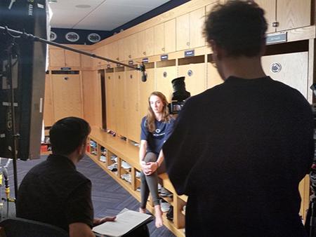 Crew interviews women's volleyball player