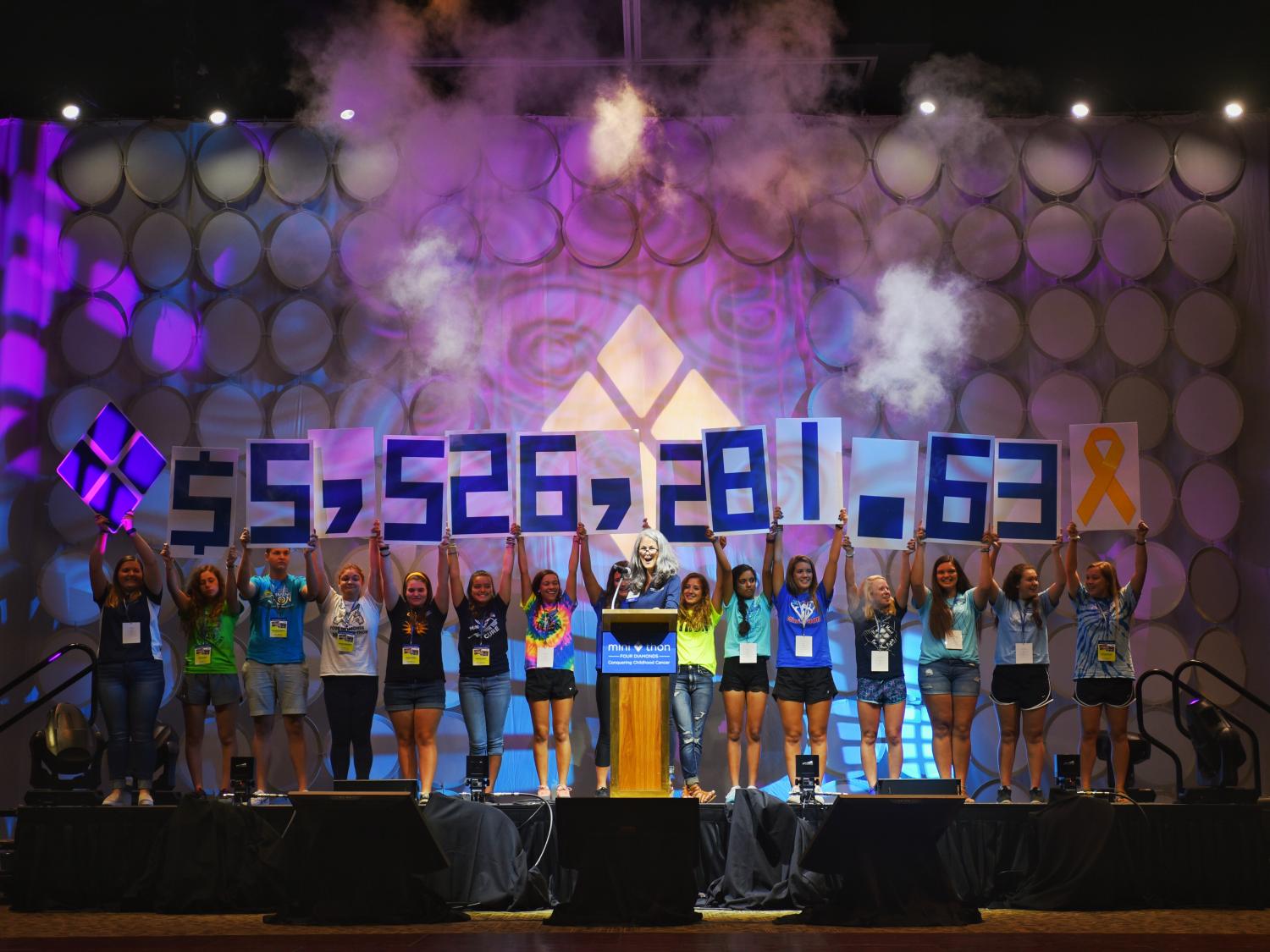 Students reveal the 2016 Mini-THON total at the Mini-THON leadership summit.