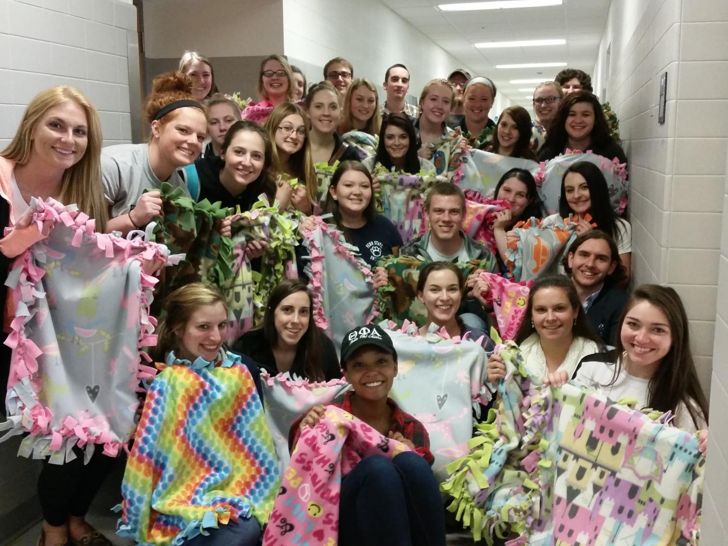 Penn State Behrend students in Instruction in Early Childhood Education Derived from Development Theories and Competing Rights: Issues in American Education courses donated $5 each to purchase fabric to make tie blankets.