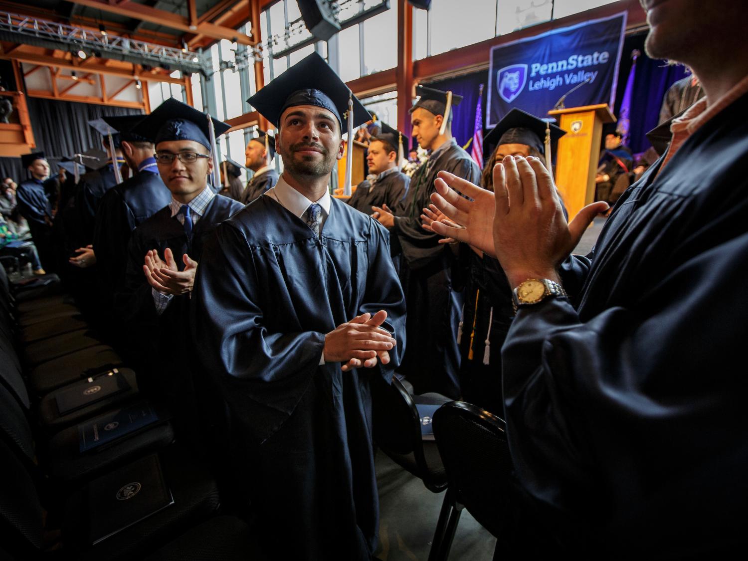 Students clapping at Commencement