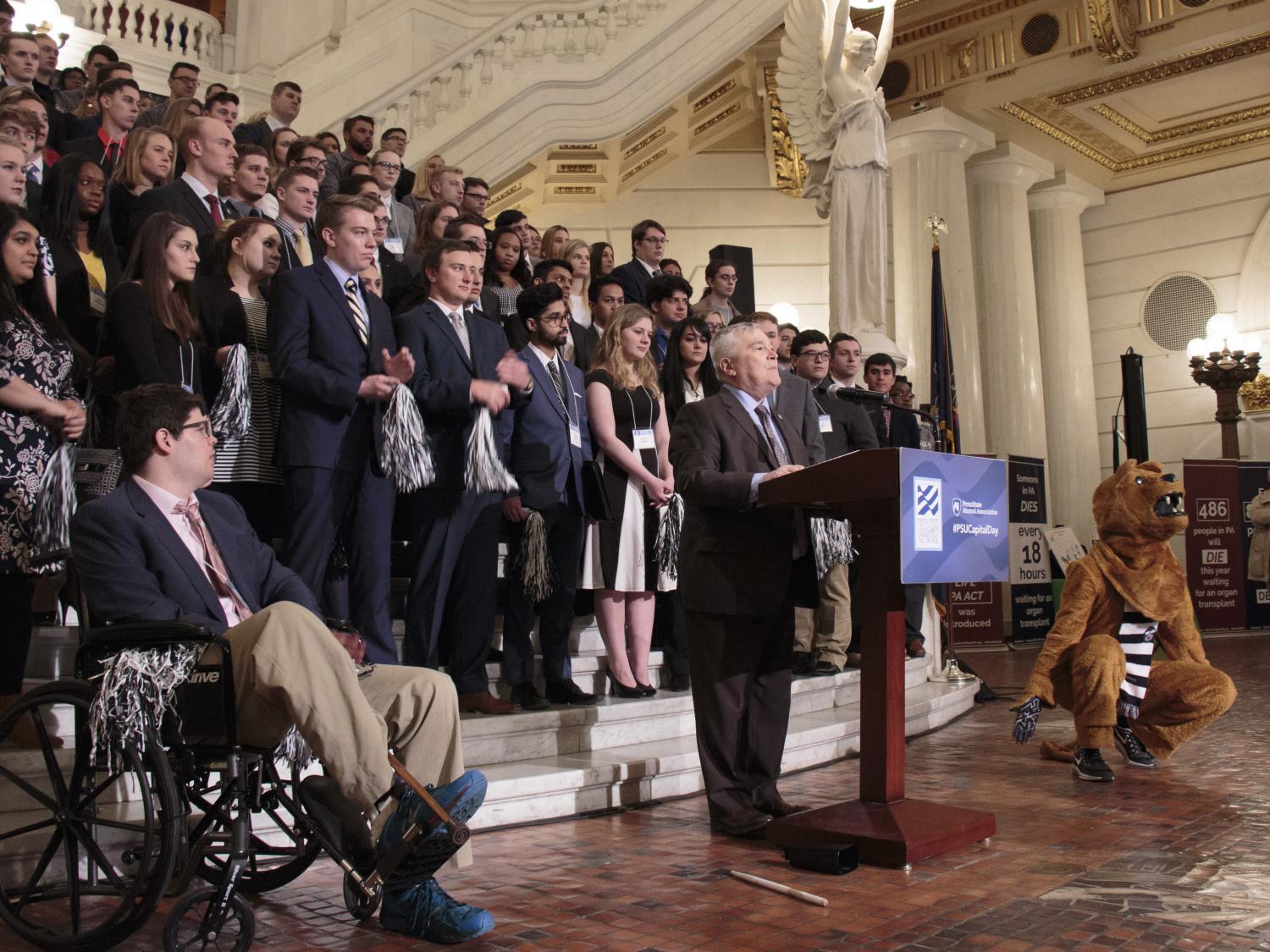 President Barron in front of rotunda steps with podium