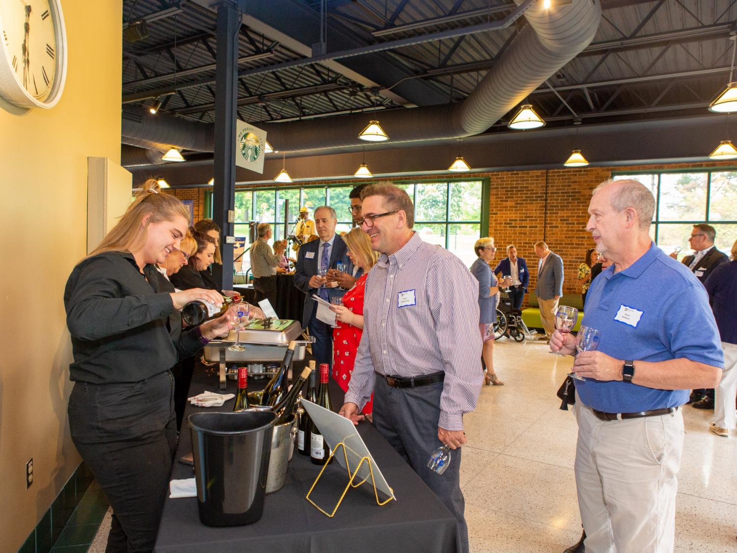 Guests are served wine in the Penn State Beaver Brodhead Bistro