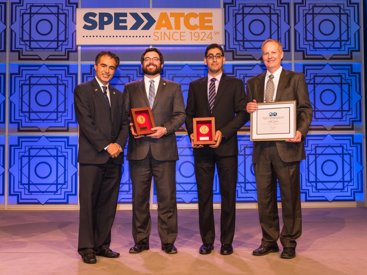 Society of Petroleum Engineers (SPE) President, Sami Alnuaim, presents Penn State researchers Michael Cronin, Hamid Emami-Meybodi and Russ Johns with Cedric K. Feguson Medals and Certificate.