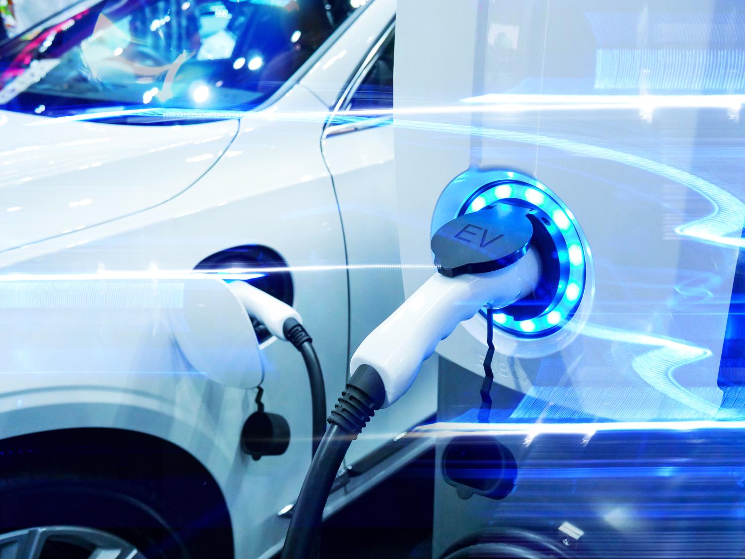 A stock image of an electric vehicle being charged.
