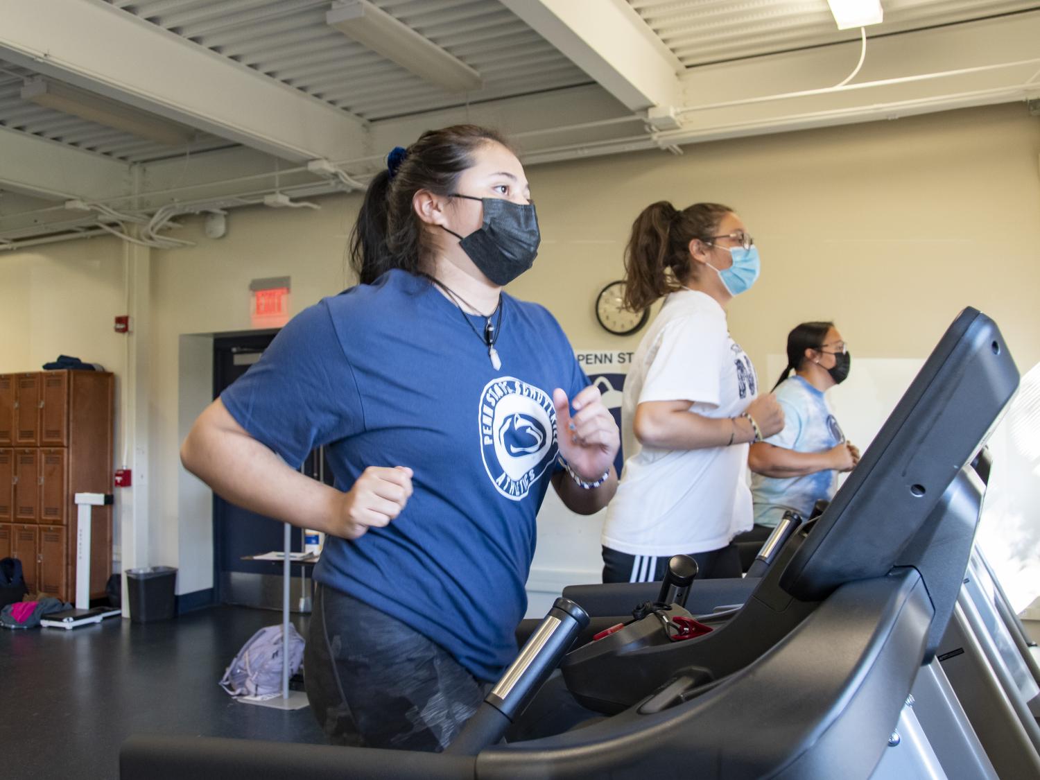 Three Penn State Schuylkill students using treadmills
